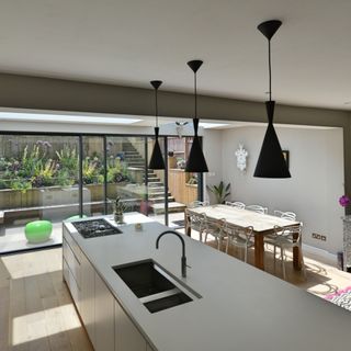 U-shaped kitchen layout with glass patio doors