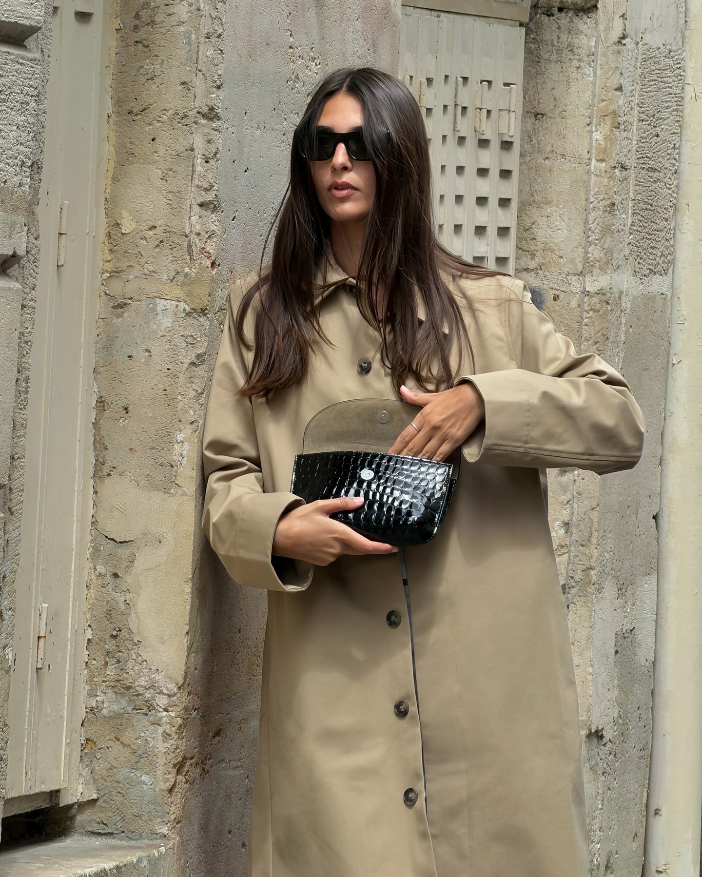 A woman with shiny, long brown hair.