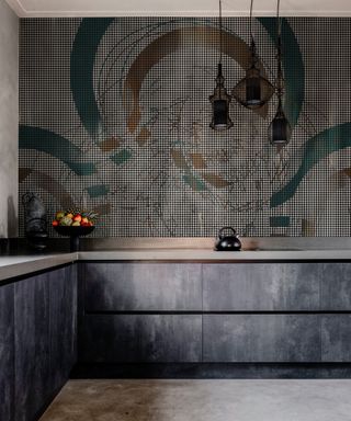 modern kitchen with dark grey metal effect drawers and doors, graphic style wallpaper with green and bronze circle pattern