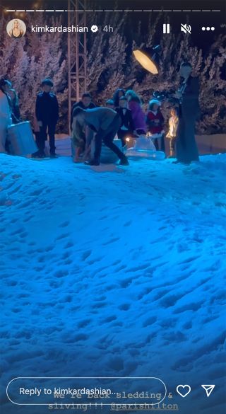 Kim Kardashian's snowy-white backyard as kids wait for sled rides