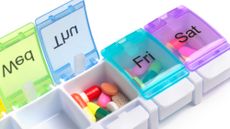 A dispenser filled with pills