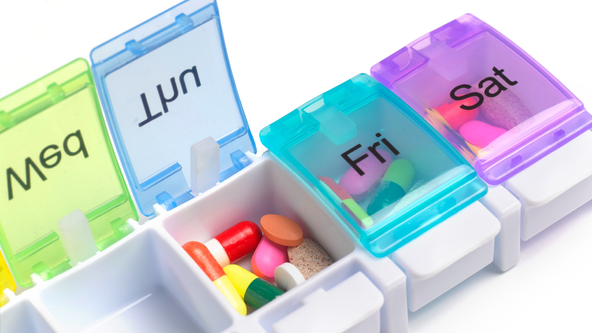 A dispenser filled with pills