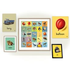 room with white wall having alphabet card on wall