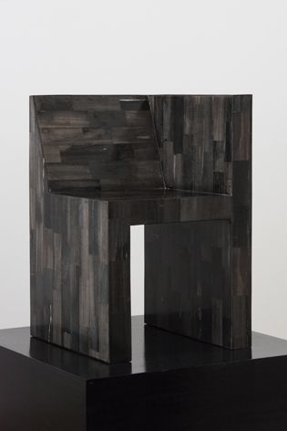 Abstract minimalist chair made from petrified wood