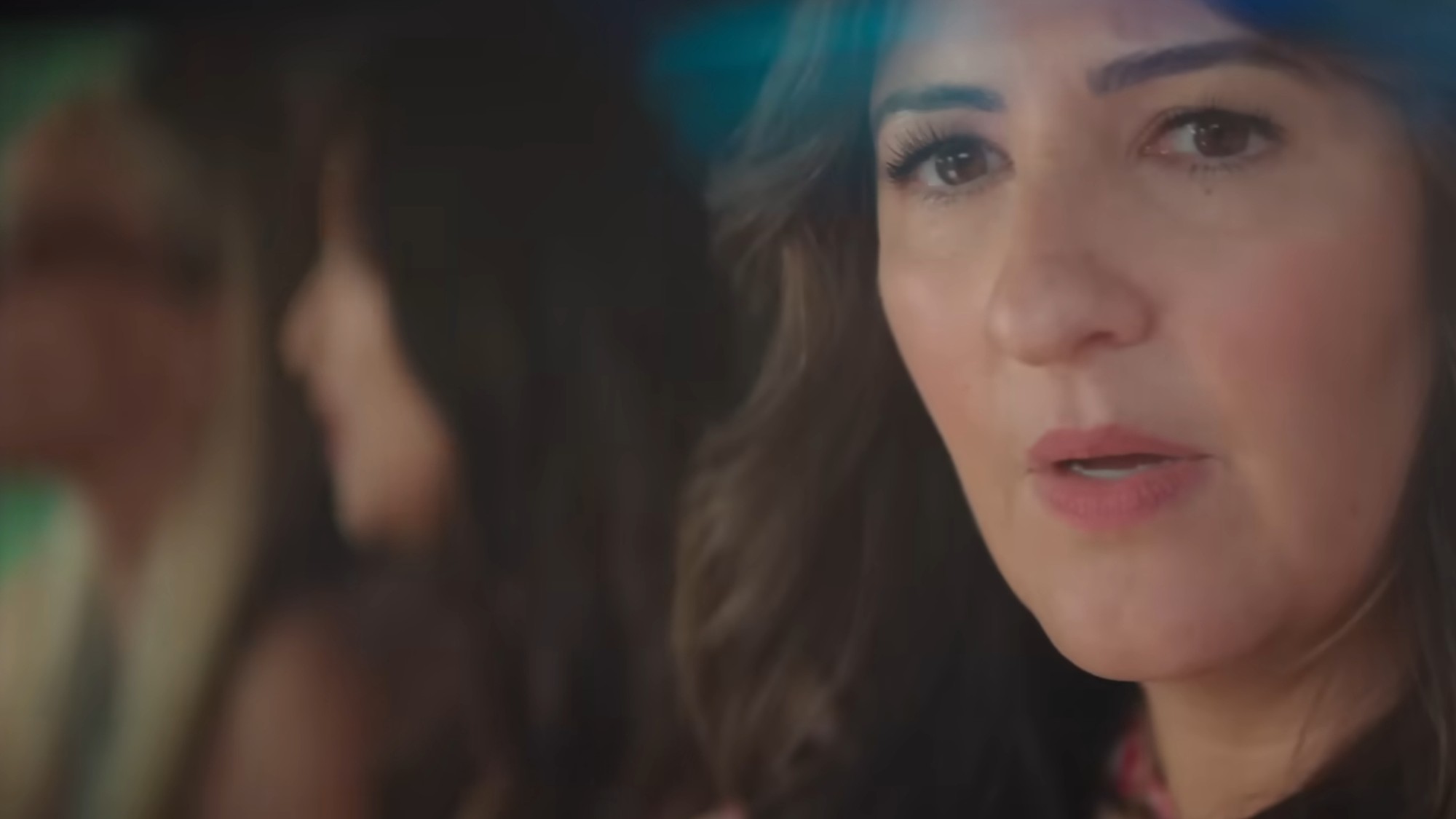 D'Arcy Carden looking out window in the Five-Star Weekend.