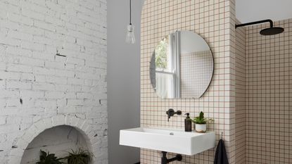 Bathroom with pendant hanging to the side of the mirror