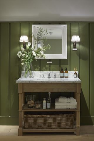 Green bathroom with wood cladding by Neptune