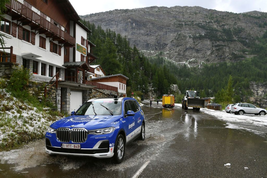 A Deceuninck-QuickStep team car tackles the poor conditions in Val d'Is&egrave;re