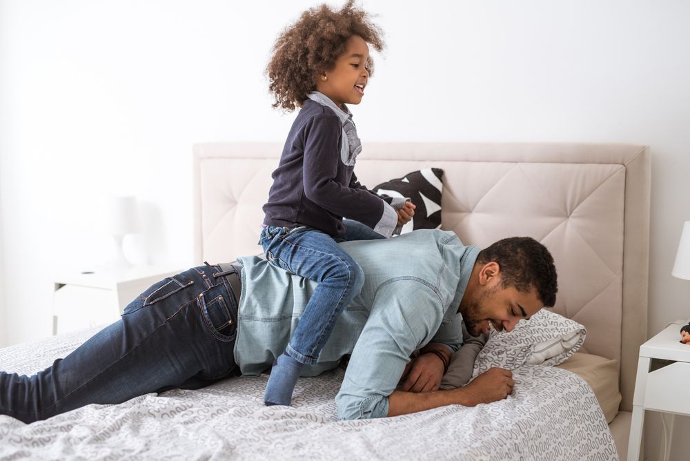 A father playing with his son.