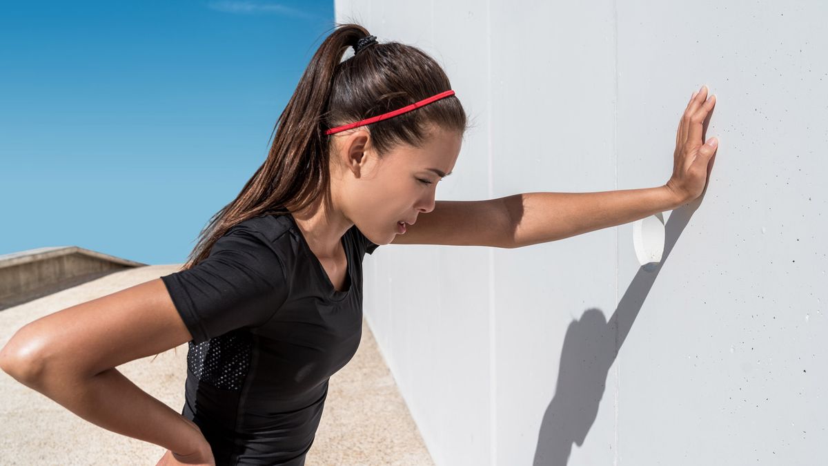 Woman hitting the wall in training