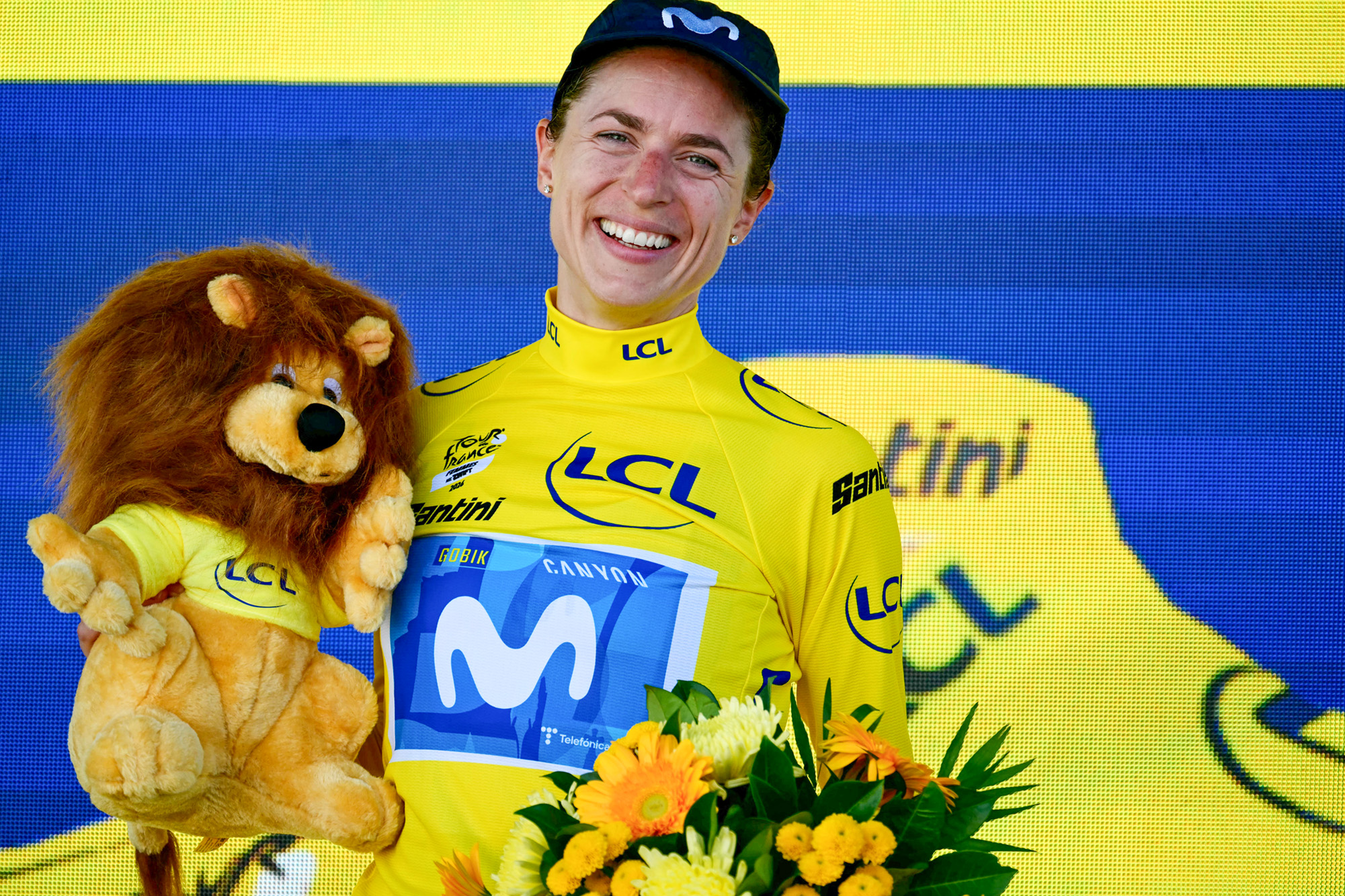 Movistar Team's Swiss rider Marlen Reusser poses on the podium with the overall leader's yellow jersey after placing second of the 5th (out of 9) stage of the fifth edition of the Women's Tour de France cycling race, 140 km from Macon to Belleville-en-Beaujolais, in Belleville-en-Beaujolais, central France on August 5, 2026. (Photo by NICOLAS TUCAT / AFP via Getty Images)