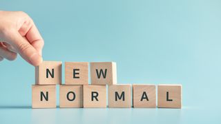 Wooden blocks spelling out "new normal"