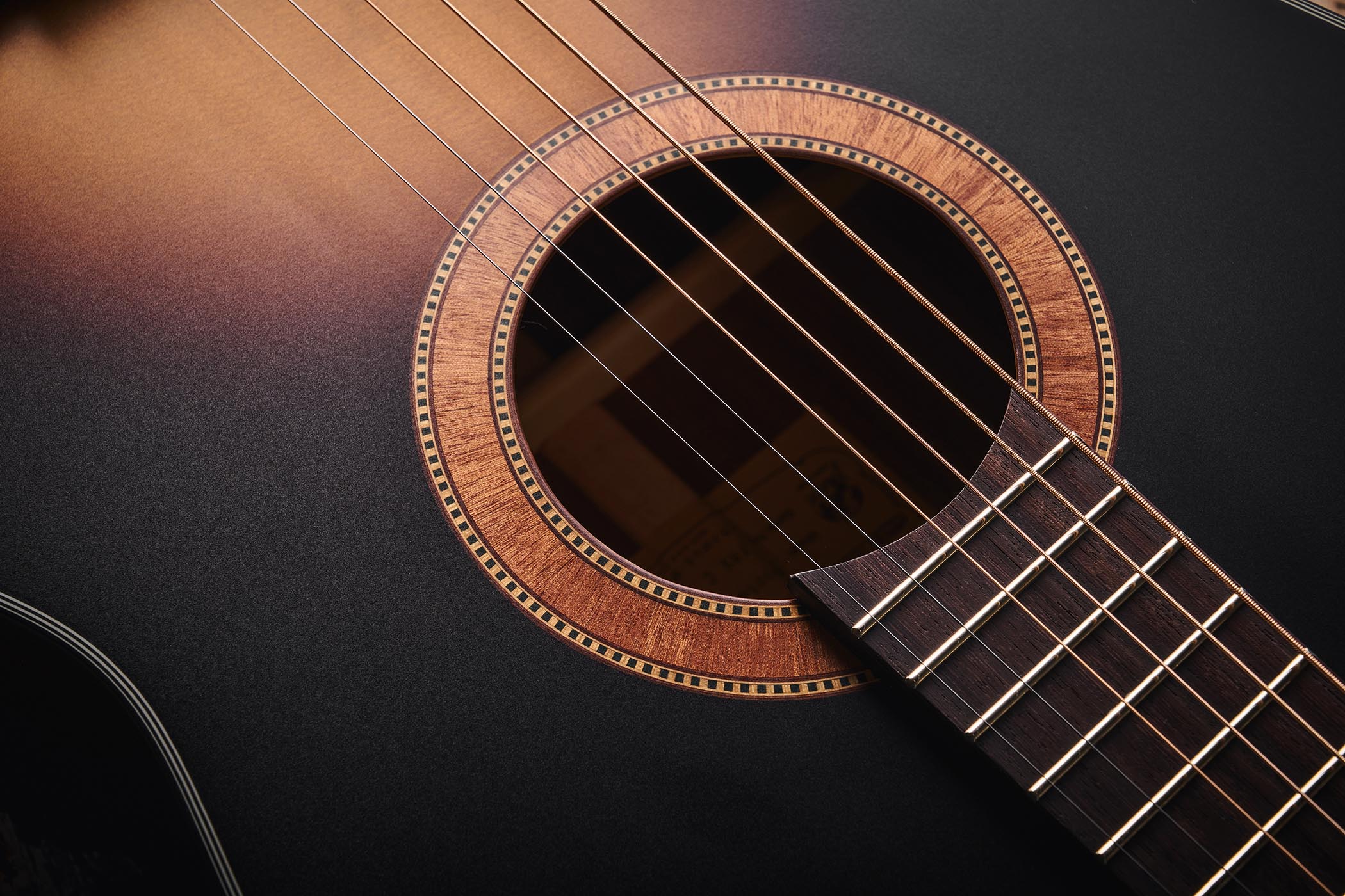 The Framus Hootenanny is inspired by the acoustics John Lennon used with the Beatles in the mid 1960s, and here is photographed in close-up against distressed wooden flooring.