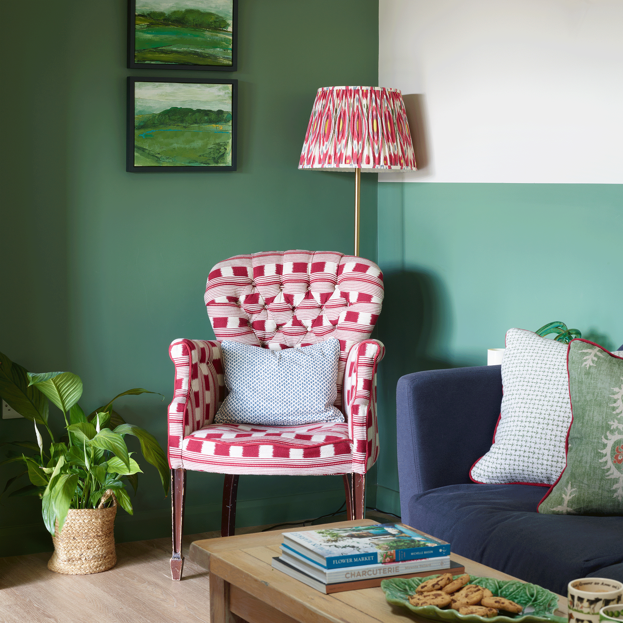 Green living room with pink armchair