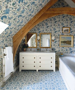 Antique bathroom with floral wallpaper