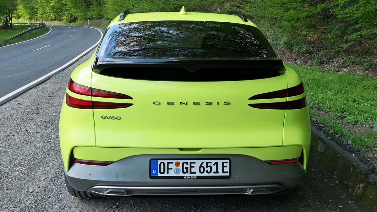 Rear view of green GV60 parked at side of road
