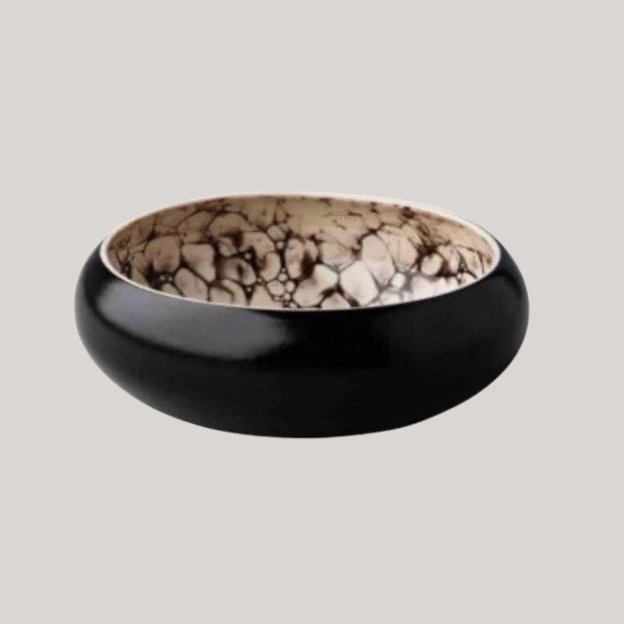Studio Raw Bubble Black Satin Deep Bowl against pale gray background.