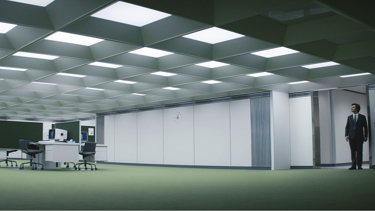 Scene from Severance showing a man staring at a vast, empty open-plan office