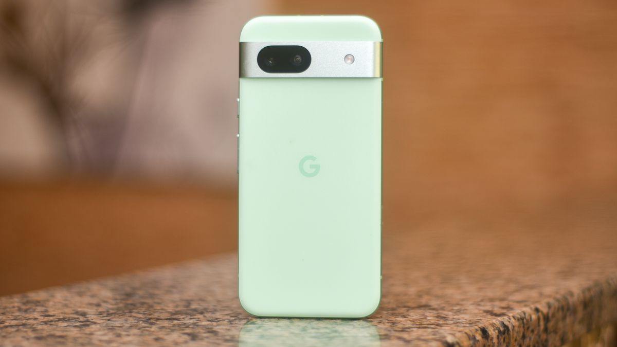 Google Pixel 8a in aloe green showing