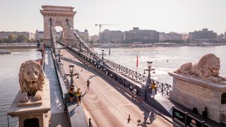 : In an aerial view, athletes compete in the women's marathon final at the Chain Bridge during day eight of the World Athletics Championships Budapest 2023 on August 26, 2023 in Budapest, Hungary.