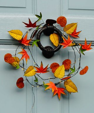 light up autumnal wreath on door from Annabel James