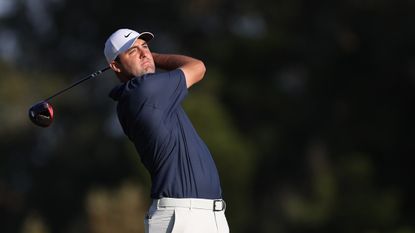 Scottie Scheffler plays his shot from the 18th tee during the final round of the US Open.