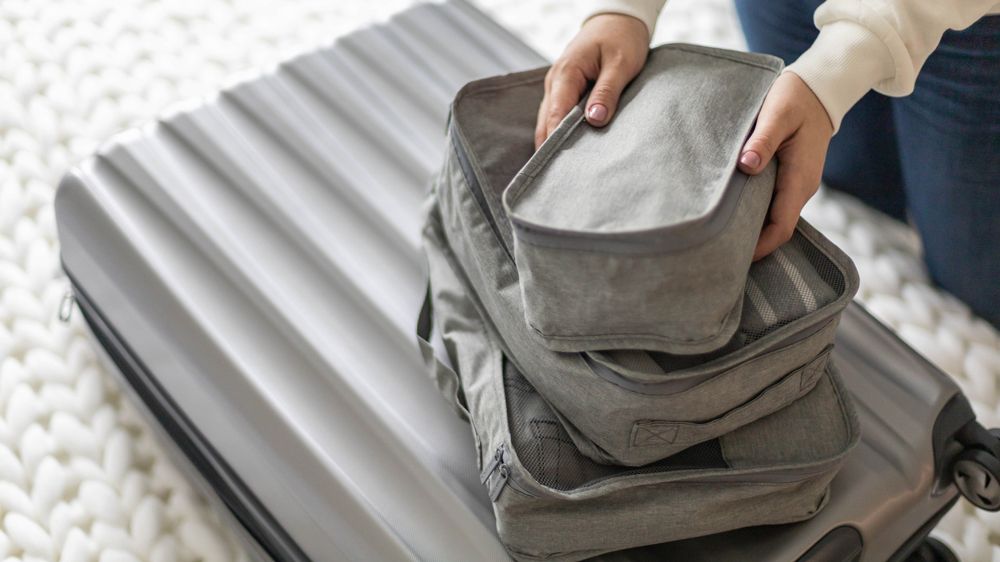 packing cubes on top of a suitcase