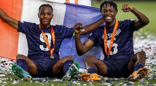 France's midfielder Mathys Tel (L) and France's defender El-Chadaille Bitshiabu celebrate winning the 2022 UEFA European Under-17 Championship final football match against Netherlands at the Netanya stadium in the Israeli city, on June 1, 2022. (Photo by JACK GUEZ / AFP) (Photo by JACK GUEZ/AFP via Getty Images)