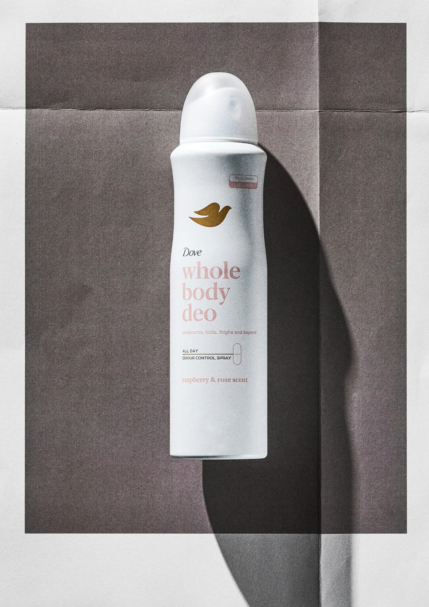 Dove Raspberry &amp;amp; Rose Whole Body Deodorant Spray on a grey background