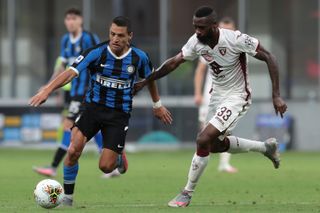 Alexis Sanchez of Inter Milan fends off Nicolas Nkoulou of Torino FC in a recent Serie A match.