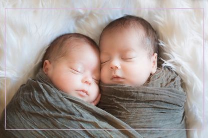 Swaddled newborn twins laying on a fur blanket
