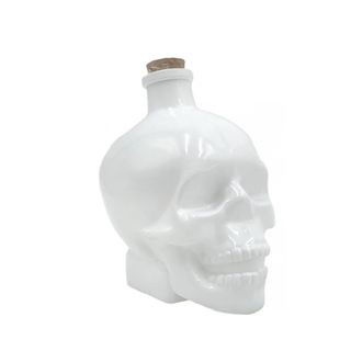 A white skull shaped bottle