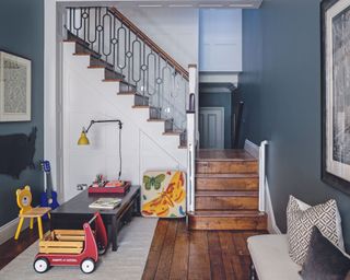 Blue playroom with dark wooden flooring