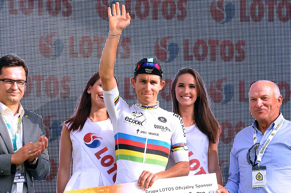 World champion Michal Kwiatkowski (Etixx-QuickStep) waves to the crowd from the staging area