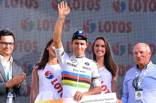 World champion Michal Kwiatkowski (Etixx-QuickStep) waves to the crowd from the staging area