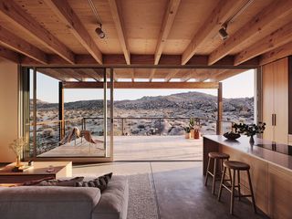 Living space with landscape views in Ryan Leidner's High Desert House