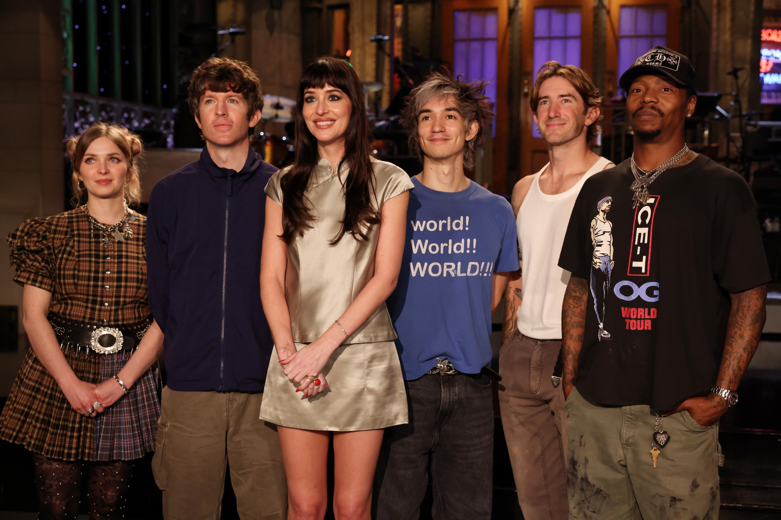Dakota Johnson hosts SNL wearing a satin miniskirt