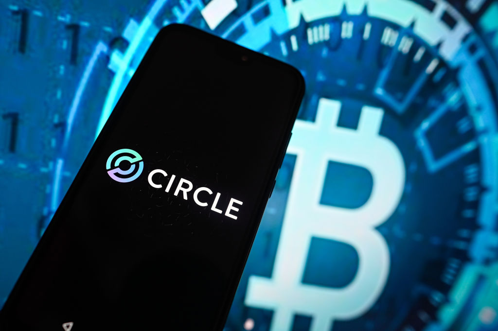 Circle logo is displayed on a smartphone