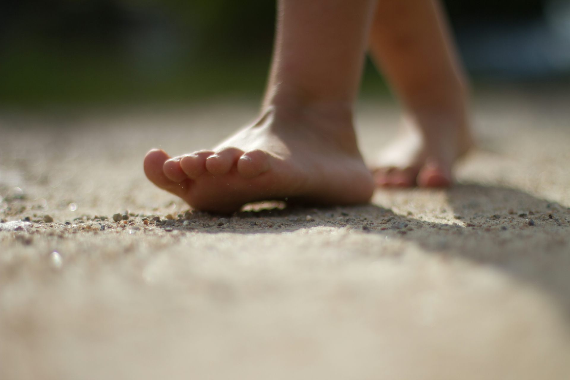 Photograph of feet of someone walking.