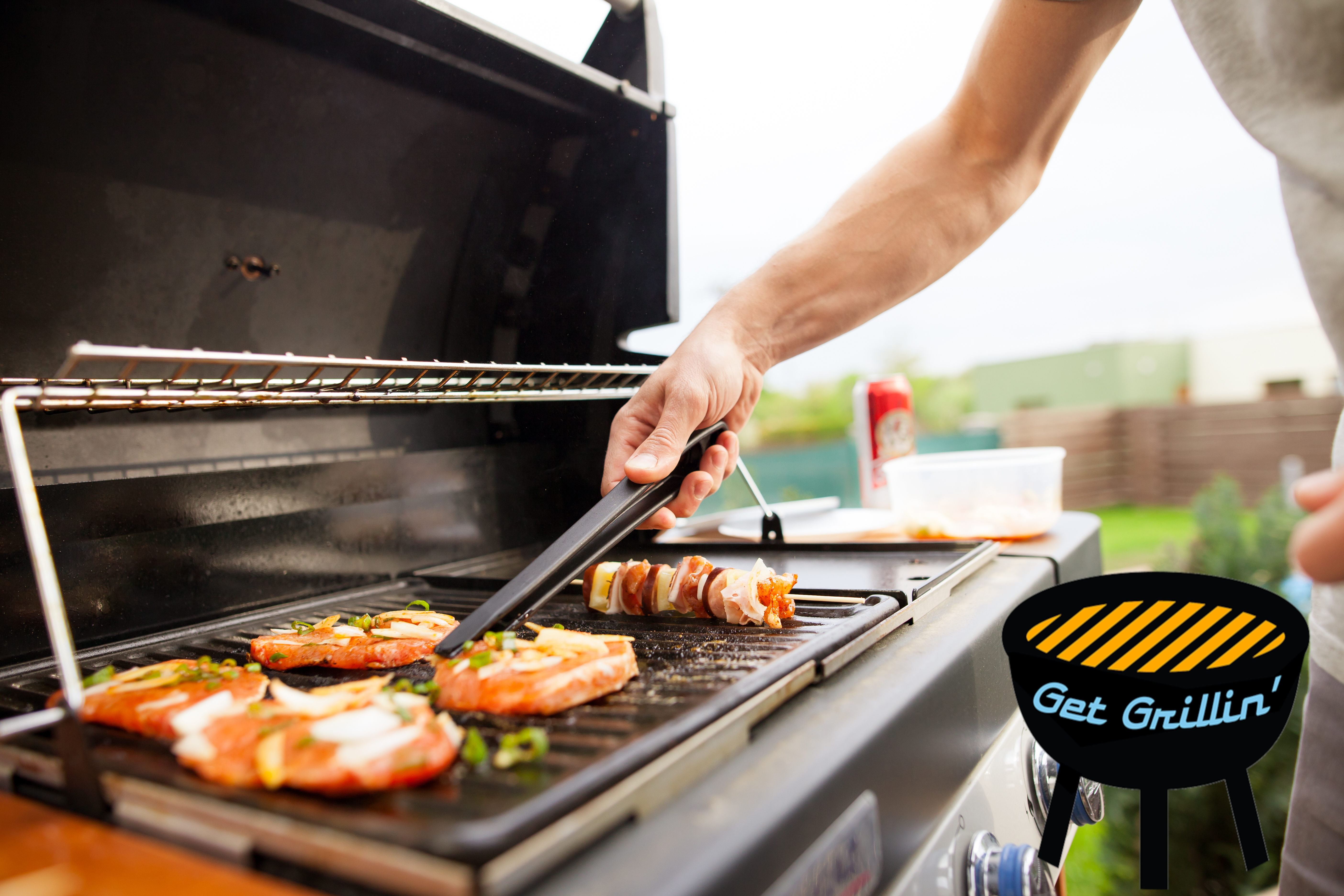 A man grilling food on an outdoor grill