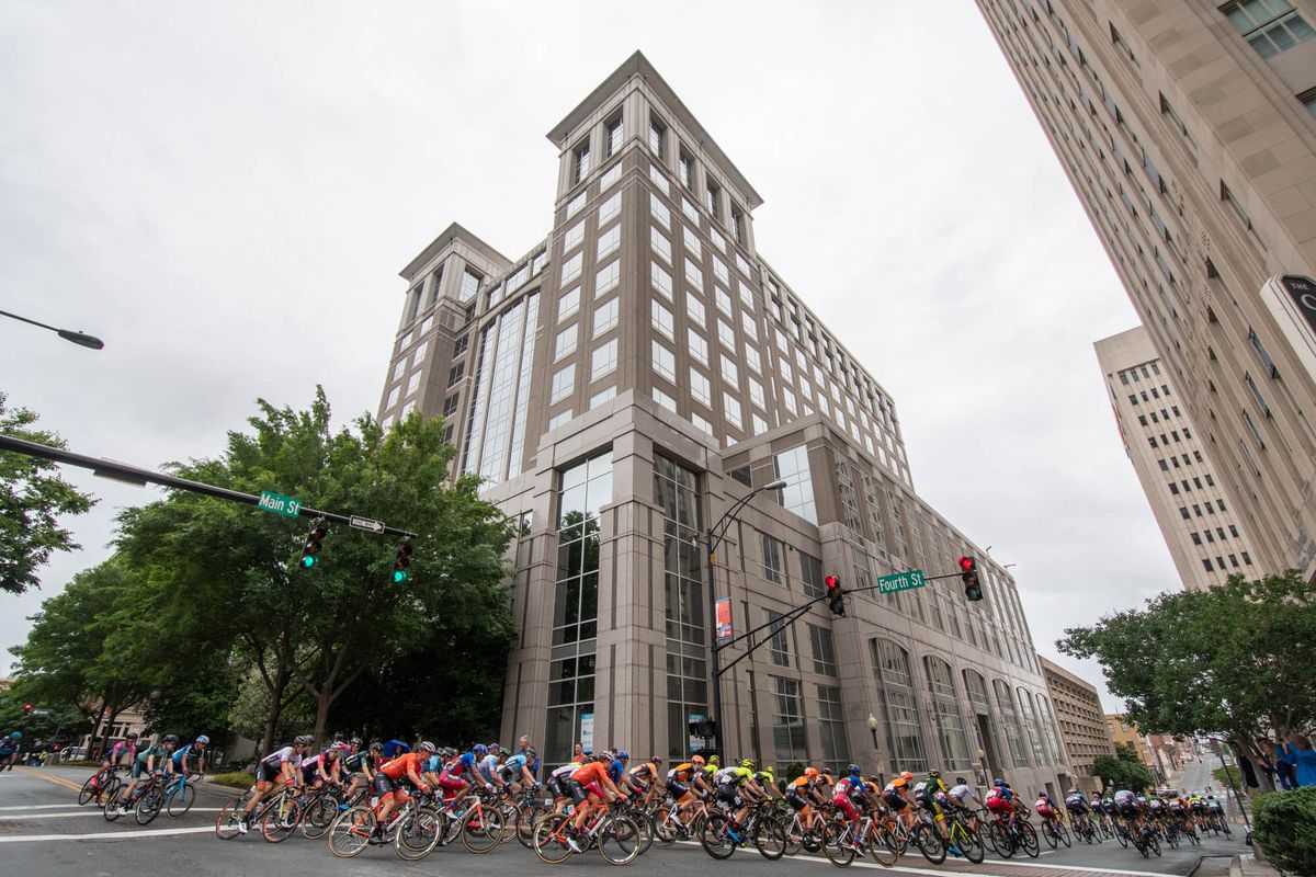 The peloton heads through downtown during the road race at the Winston-Salem Cycling Classic