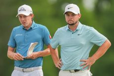  Matt Fitzpatrick and Alex Fitzpatrick of England watch others to finish on the 18th green during the Final Round of the Zurich Classic of New Orleans