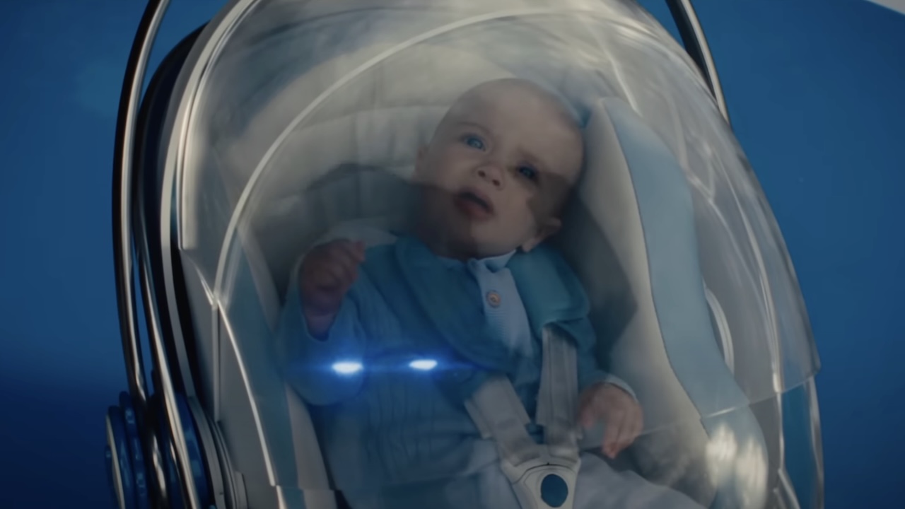 Infant Franklin Richards looking up at Galactus while seated in baby carrier