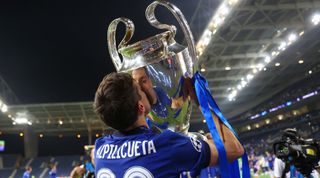 Cesar Azpilcueta celebrates with the Champions League trophy after Chelsea's win over Manchester City in 2021.