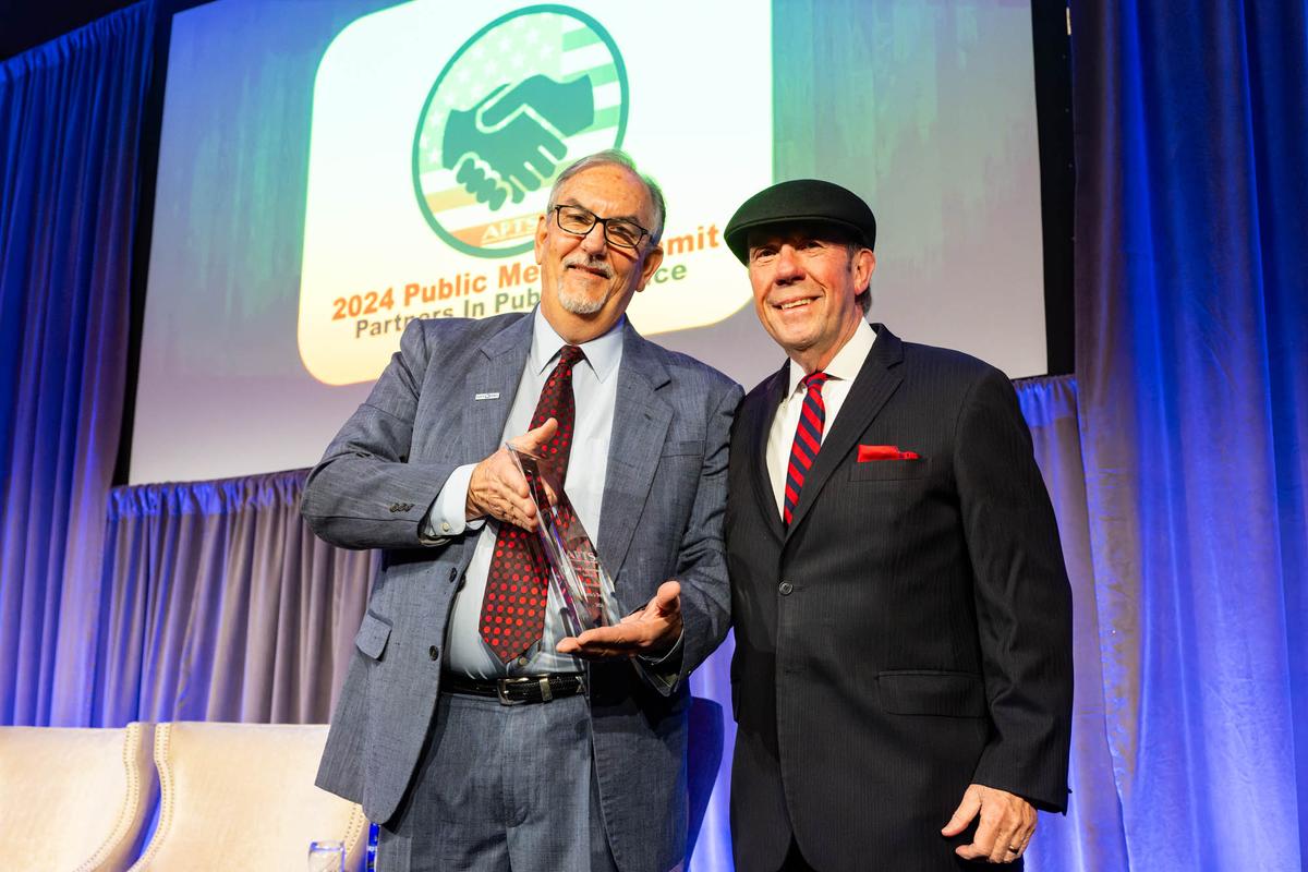 Patrick Butler (left) receives the APTS Lifetime Achievement Award