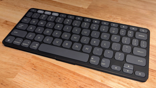 Logitech Keys-to-Go 2 keyboard in black, sitting on a wooden desk