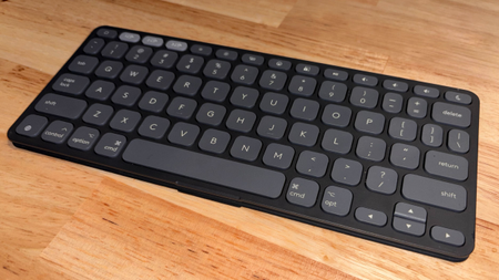 Logitech Keys-to-Go 2 keyboard in black, sitting on a wooden desk