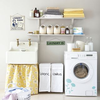 Utility room with flower stickers on washing machine