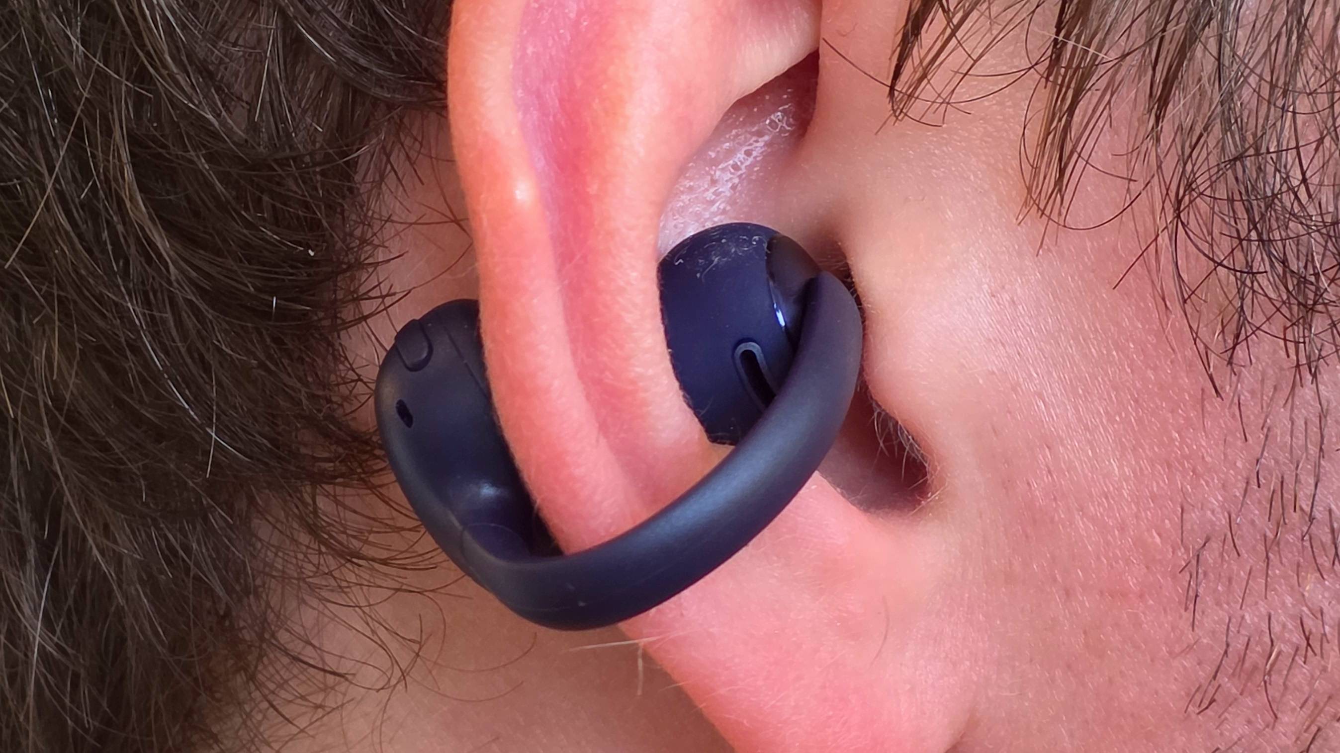 The Baseus Bowie MC2 in a man's ear.