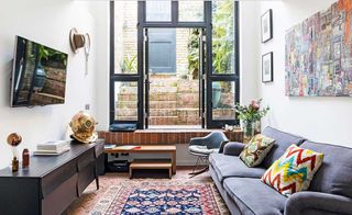 Entrance with full height glass door in a workshop conversion